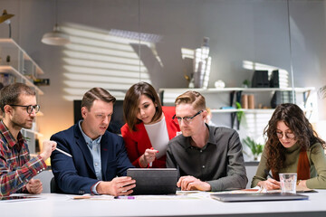 Business people Talking Strategy With Tablet At Office Desk. In Creative Team In Office Productive...