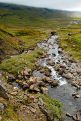 Klifbrekkufossar, beautiful row of waterfalls, in Mjoifjordur village, Iceland