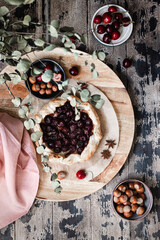 Rustic Cherry Galette on a wooden background, top view