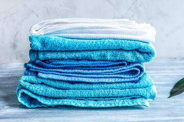 Towels pile in housekeeping set on laudry background mock-up