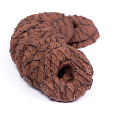 Heap of chocolate round cookies with heart-shaped hole