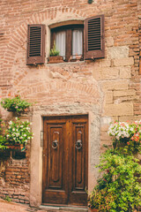 Fototapeta na wymiar beautiful door in a street of old medieval village in Tuscany