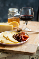 delicious cheese snack with honey fruit