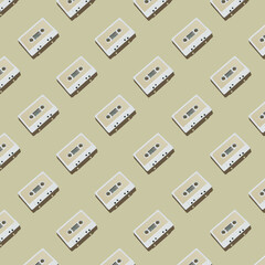 Pattern of audio cassette with copy space. Vintage white audio cassette tap on colored background. Old cassette tape audio isolated.