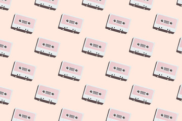 Pattern of audio cassette with copy space. Vintage white audio cassette tap on colored background. Old cassette tape audio isolated.