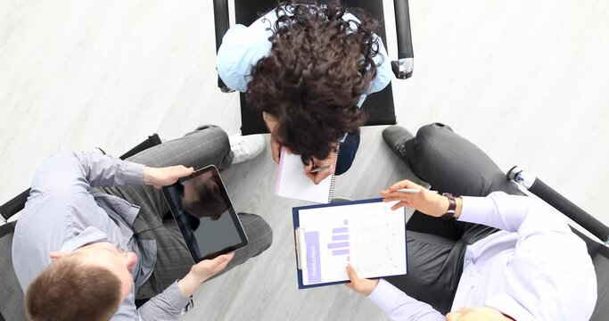 Group of people talking business and shaking hands