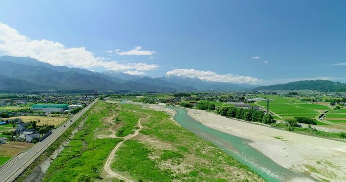 Aerial : Summer mountain and paddy field in Japan