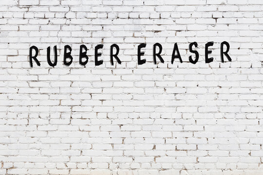 Word Rubber Eraser Painted On White Brick Wall