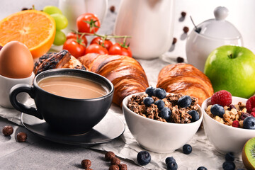Breakfast served with coffee, juice, croissants and fruits
