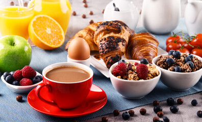 Breakfast served with coffee, juice, croissants and fruits