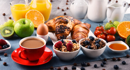 Breakfast served with coffee, juice, croissants and fruits