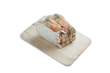 Moldy Whole wheat bread loaf on cutting board over white background.