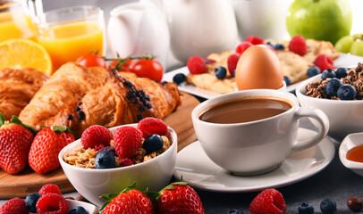 Breakfast served with coffee, juice, croissants and fruits