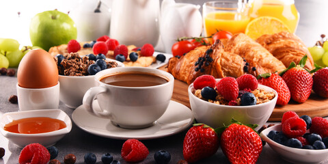 Breakfast served with coffee, juice, croissants and fruits