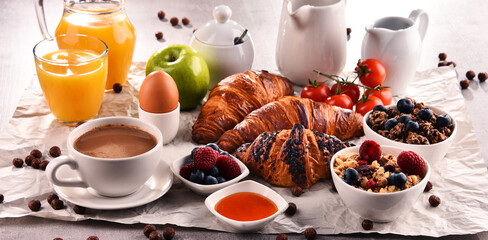 Breakfast served with coffee, juice, croissants and fruits