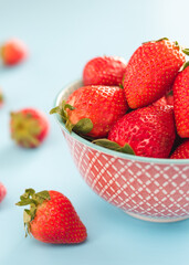 strawberries in a bowl on a colorful background