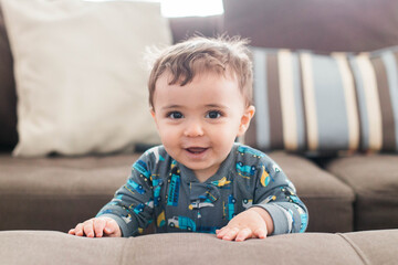 little boy sitting on the floor