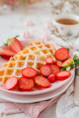 Simple crispy homemade waffles with strawberries