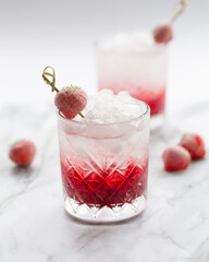 Strawberry Cold Cocktail. Fresh summer cocktail with strawberry and ice. Glass of strawberry soda drink.