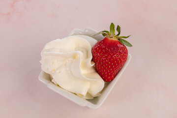Obraz na płótnie Canvas Strawberry with whipped cream