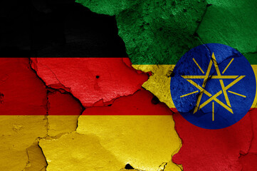 flags of Germany and Ethiopia painted on cracked wall