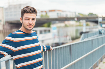 Young man  in the city. One young beautiful guy, selective focus, copy space
