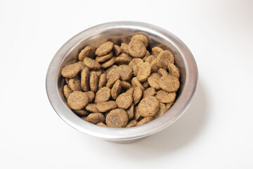 Balanced, healthy dog ​​food in a bowl on a white table