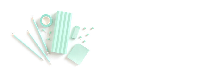 Banner with set of mint stationery on a white background.