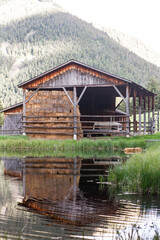 Old wooden Barn on a lake 