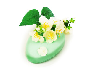 Soap with fresh flower jasmine and green leaves. Isolated on whi