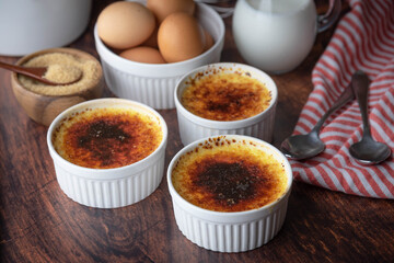 creme brulee and ingredients, milk, egg and sugar