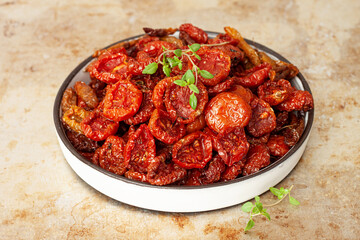 Sun-dried cherry tomatoes with olive oil and herbs.