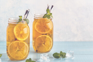 Iced tea with lemon slices and mint.