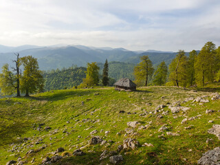 Fototapeta na wymiar Romania, Buila Vanturarita Mountains, small house in the mountains, sheepfold 