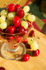 various fresh natural organic berries: cherry and grape