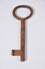 Rusty key on a withe background