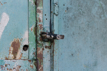 Door handle. Iron gate. Rusty metal.