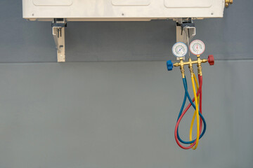 Air Conditioning Technician Repairing Air Conditioner and install new air conditioner.