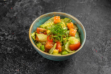 chinese salad in black bowl in restaurant