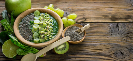 Green smoothie bowl with chia seeds, healthy superfood breakfast 