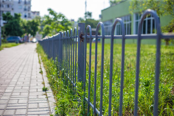 Old abandoned fence on the street