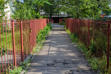 Old abandoned fence on the street