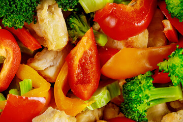 Macro shot of chopped vegetables and chicken for salad.