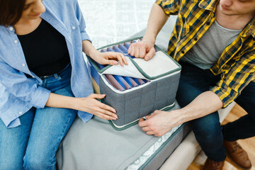 Couple choosing mattress core in furniture shop