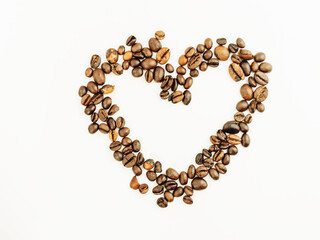 Coffee beans isolated on a white background. Heart made from coffee beans with place for text. Freshly roasted coffee. Love.