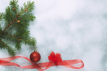 Christmas background with Christmas trees and decorations on a light background.