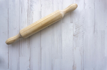 wooden roller on white wooden background