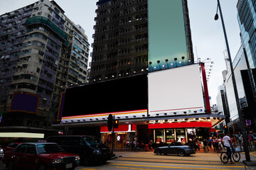 Publicity mock up area for advertising or commercial information Lightbox on exterior of modern buildings in downtown,blank billboards with copy space on skyscraper facade in business district of city © BullRun