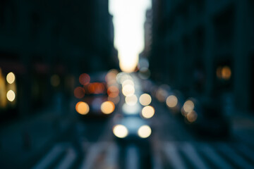 Blurred background with defocused Metropolis urban setting and automobiles driving on road in evening time, shiny circles bokeh of cars moving in downtown on avenue at dusk in district avenue