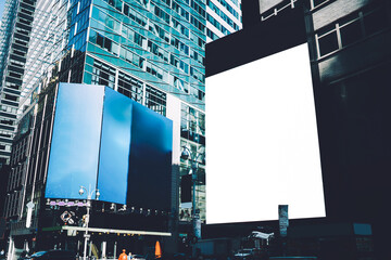 Publicity mock up area for advertising or commercial information Lightbox on exterior of modern buildings in downtown,blank billboards with copy space on skyscraper facade in business district of city © BullRun